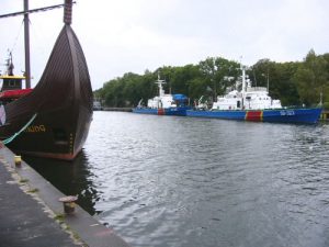 Kolobrzeg harbor with replica of Viking