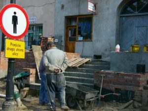 Sign and workers in Zamosc