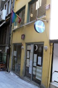 Rainbow flag in alley leading to