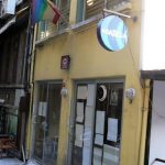 Rainbow flag in alley leading to