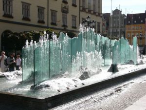 Modern glass fountain in the central