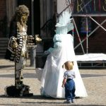 Costumed mimes in central square, called