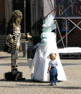 Costumed mimes in central square, called