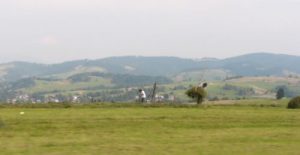 Farmers harvesting hay in the valley