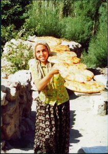 Baking bread in an outdoor wood-fired