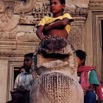 Angkor Wat boy on lion