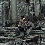 Angkor kids playing on ruins