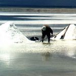 Uyuni Salt Lake shoveling salt