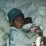 Uyuni Salt Lake child bagging salt
