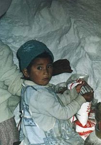 Uyuni Salt Lake child bagging salt