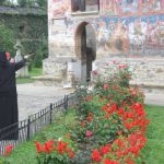 Moldovita Monastery - Nun Explaining Frescos