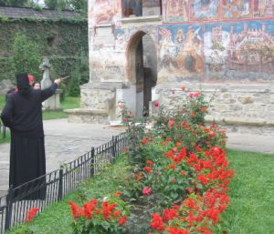 Moldovita Monastery - Nun Explaining Frescos