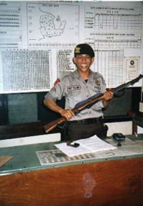 Proud policeman with gun