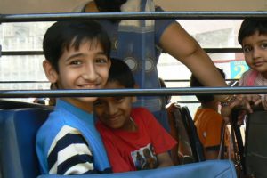 Sweet-faced students on a private school bus. Private schools are