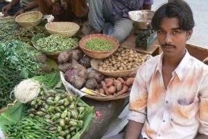 Vendor selling farm produce.