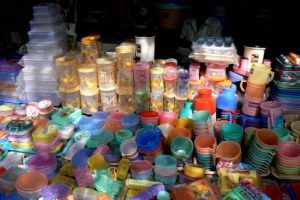 Colorful plasticware for sale along the