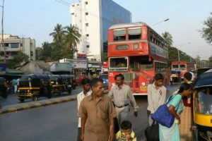 London-style double-decker buse and local tuk-tuk