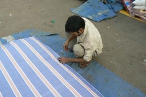 Making a mattress on a street