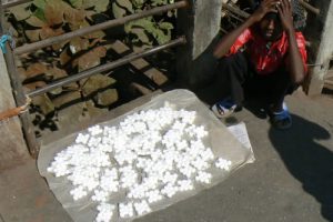 Child selling sweets.