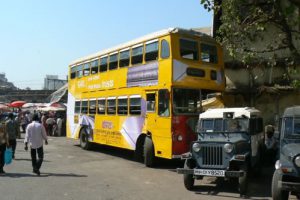 Double-decker bus and jeeps