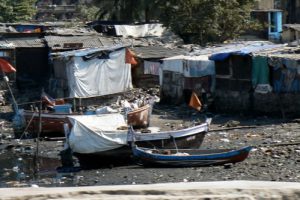 Squatter village by a polluted river