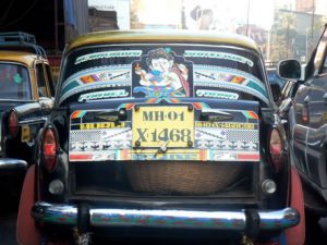 Decorated taxi on jammed street.