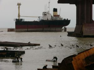 Pushing barrels of oil drained from