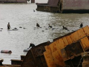 Pushing barrels of oil drained from