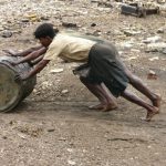 Pushing barrels of oil drained from