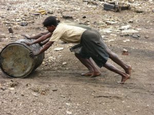 Pushing barrels of oil drained from