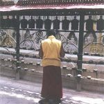 Monk and Prayer Wheels