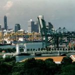 Harbor cranes and skyscrapers