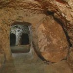 Ancient underground tomb with round door