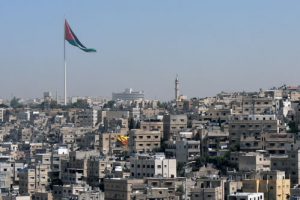 Amman - Jordanian flag over the city