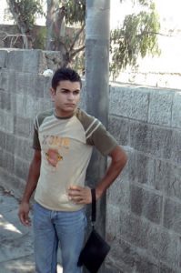 Amman - city scene; a guy needs a good purse.