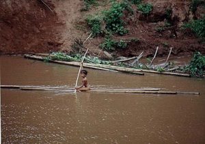 Rural girl on bamboo raft