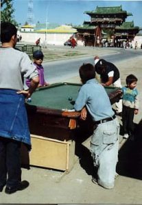 Kids playing pool at Gandam
