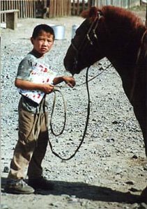 Boy with horse and book
