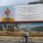 Downtown Kingston - shop with mural of Simon Bolivar of