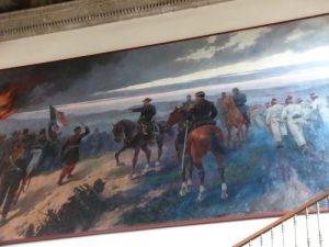 Murals inside Chapultepec Castle depict military events.