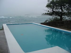 Swimming pool by the sea at Blue Harbour House