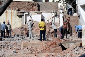 Bangalore - new buildings replace the old. Most demolition labor