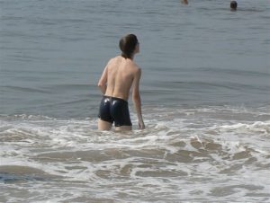 European guy watches para-sailing at Calangute