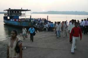 Crowded ferry unloads near Calangute