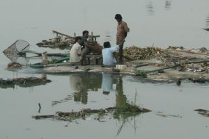 Hyderabad - workers on Hussain Sagar