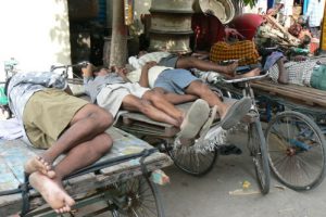 Vijayawada - bicycle cargo drivers napping.