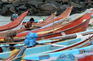 Kanyakumari - fisherman repairs nets