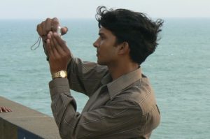 Kanyakumari - handsome tourist taking photo