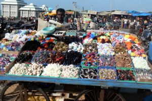 Kanyakumari vendor selling trinkets.