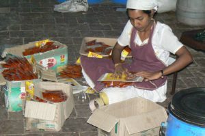 Kochi - packaging spices in a shop in the